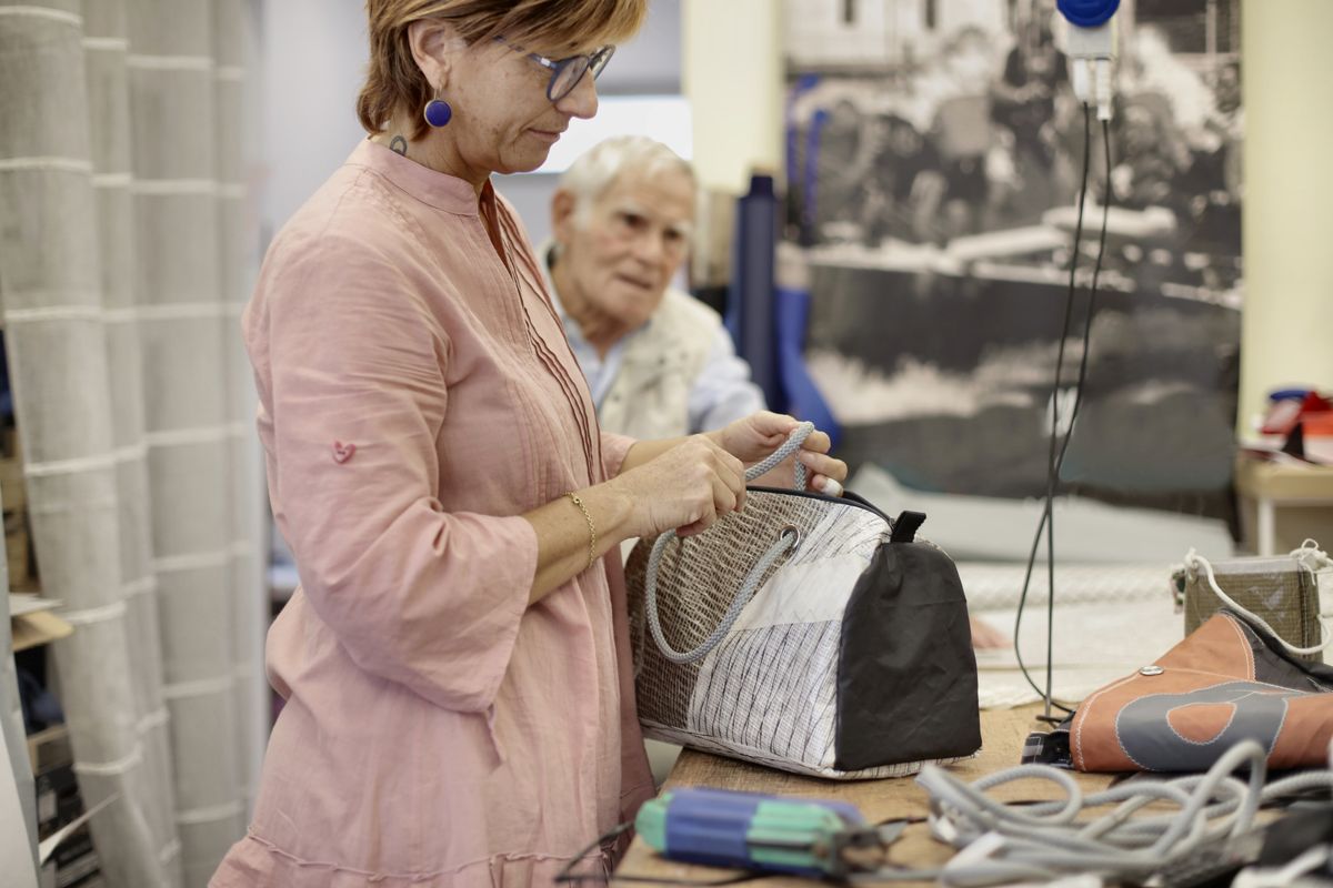 Artisan handcrafting a handbag in a leather workshop — handbag development and sampling
